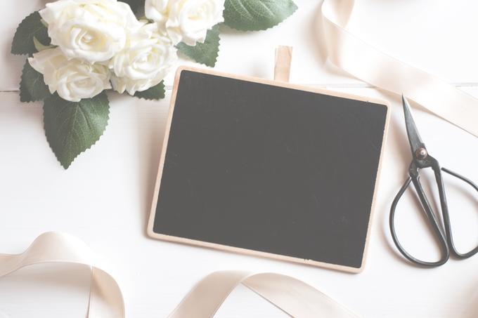 Image of a black chalkboard, scissors, and a  bouquet of white flowers - 80 Creative and inspiring engagement party ideas - Image