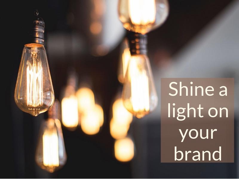 Light bulbs hang from the ceiling; shine light on your brand - Personal branding for freelancers: Tips and tricks for your business - Image